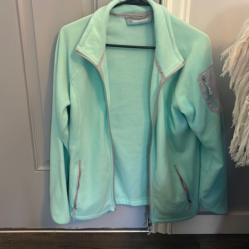 Teal Free Country polyester jacket.